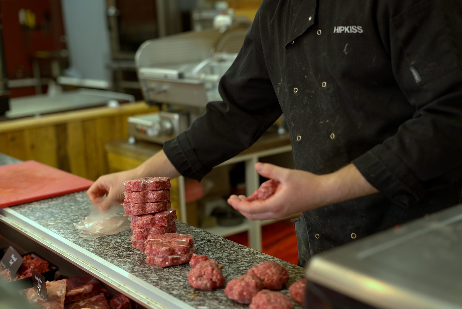 Butcher preparing fresh burgers