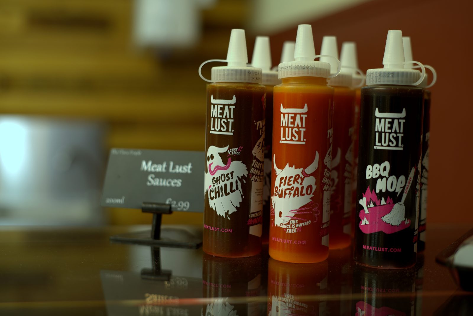 Meat Lust marinade and sauce bottles